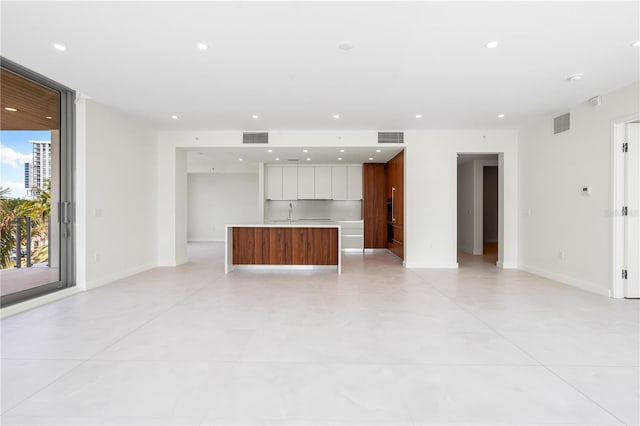 unfurnished living room featuring expansive windows