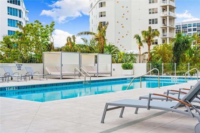 view of swimming pool with a patio