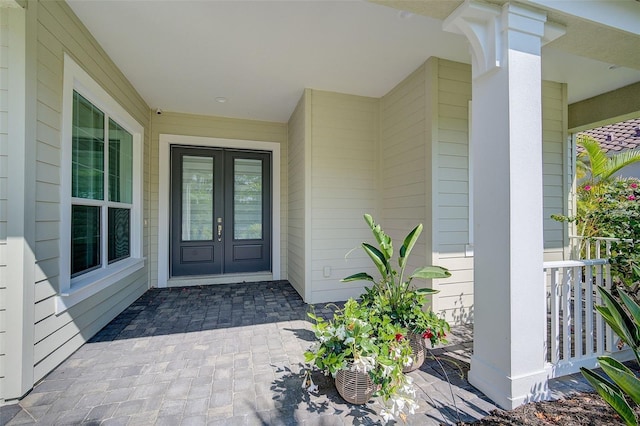 view of exterior entry featuring french doors