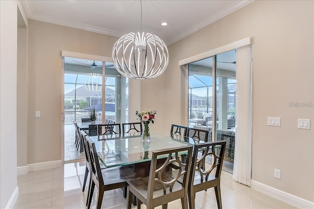 dining area with an inviting chandelier, crown molding, and light tile patterned flooring