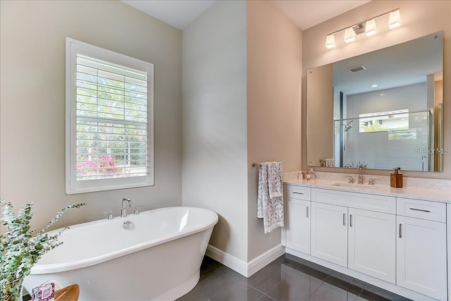 bathroom with tile patterned flooring, shower with separate bathtub, and vanity