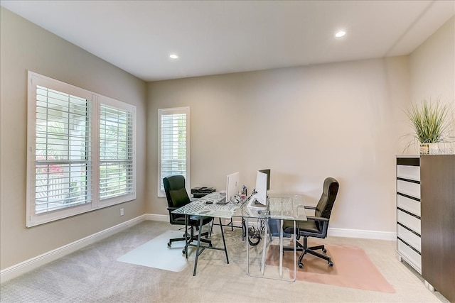 office area featuring light colored carpet