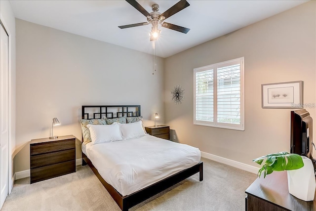 carpeted bedroom with ceiling fan