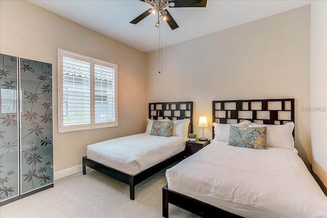 bedroom with light colored carpet and ceiling fan