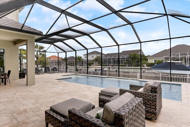 view of swimming pool with a lanai and a patio area