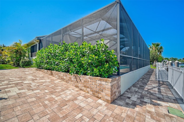 exterior space featuring a lanai and a patio