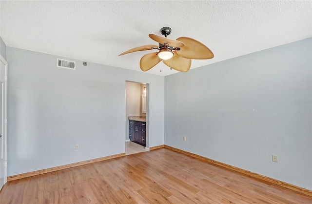 unfurnished room with ceiling fan and light hardwood / wood-style flooring