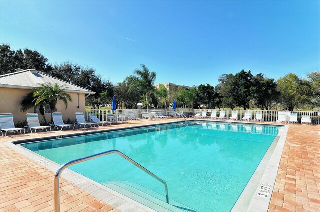 view of swimming pool featuring a patio