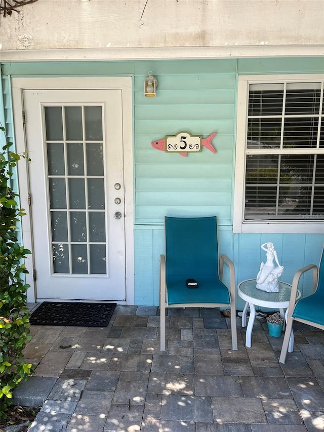 doorway to property with a patio