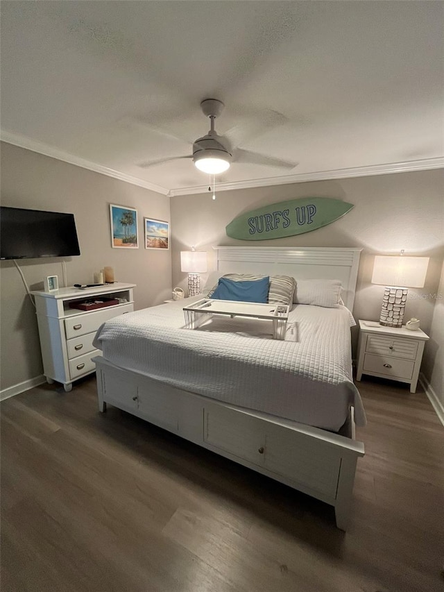 bedroom with ceiling fan, dark hardwood / wood-style flooring, and ornamental molding