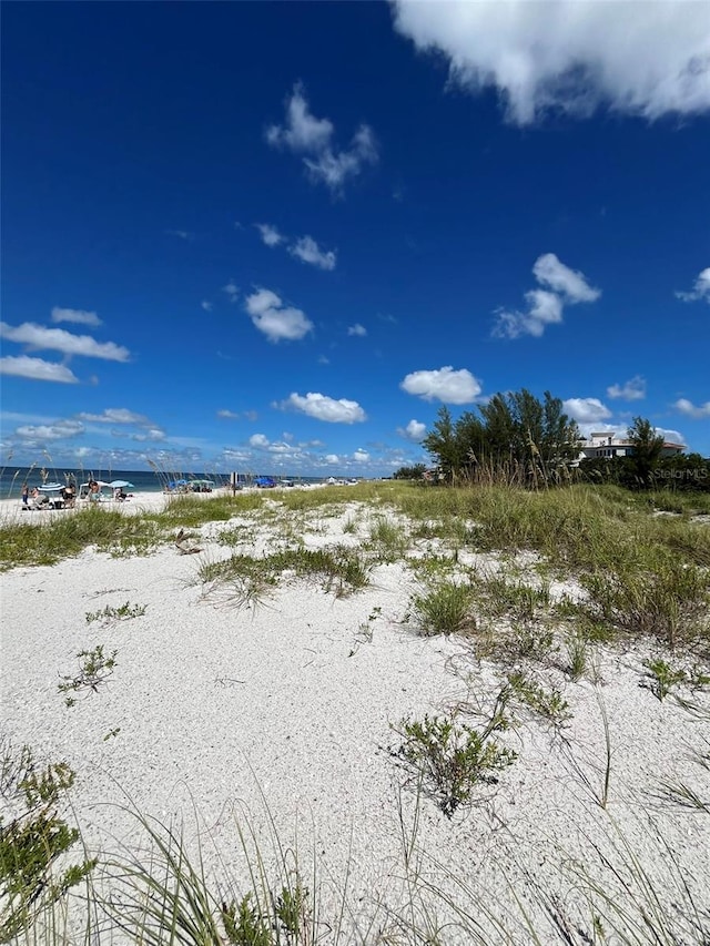 exterior space with a beach view and a water view