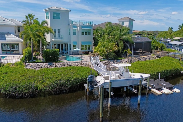 dock area featuring a balcony and a water view