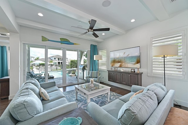 living room with ceiling fan, dark wood-type flooring, and beamed ceiling