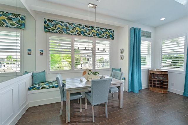 dining space with dark wood-type flooring and breakfast area