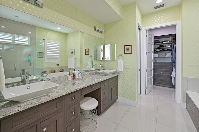 bathroom with vanity, tile patterned floors, and separate shower and tub