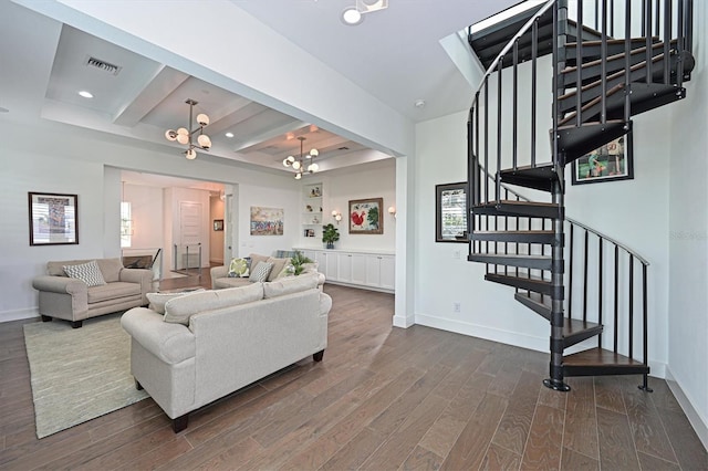 living room with beam ceiling, dark hardwood / wood-style floors, and an inviting chandelier