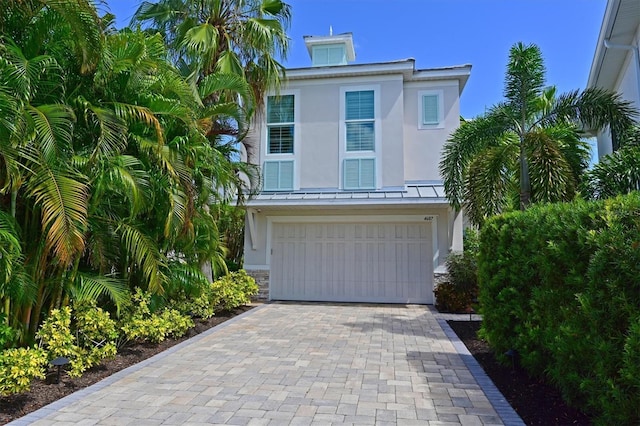 raised beach house with a garage