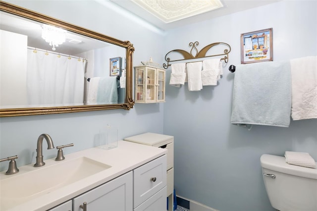 bathroom featuring vanity and toilet