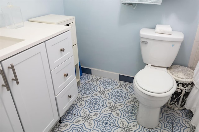 bathroom with toilet and vanity