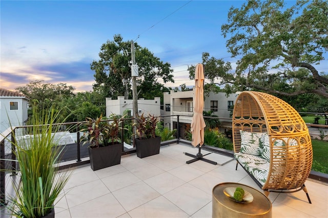 view of patio terrace at dusk