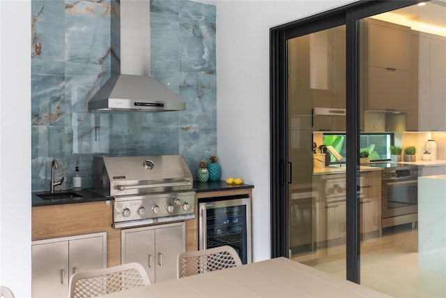 kitchen with stainless steel electric range oven, tasteful backsplash, sink, wine cooler, and wall chimney exhaust hood