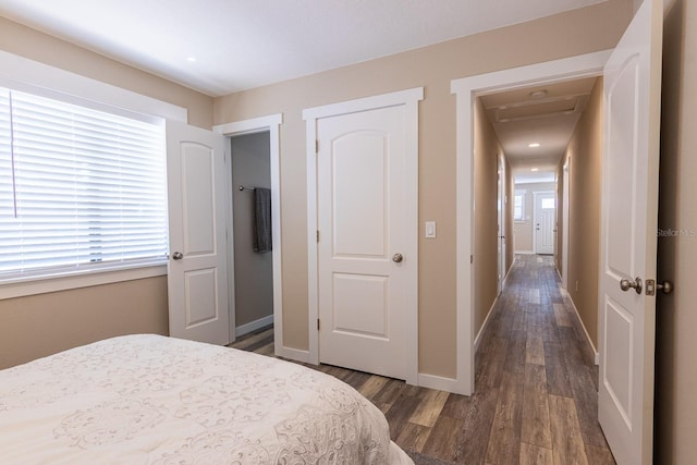 bedroom with dark hardwood / wood-style floors