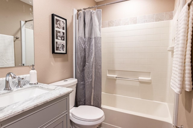 full bathroom with vanity, shower / tub combo with curtain, and toilet