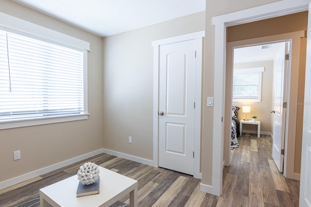 living area with dark hardwood / wood-style floors