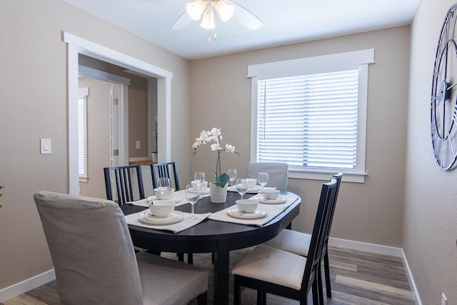 dining room with wood-type flooring and ceiling fan