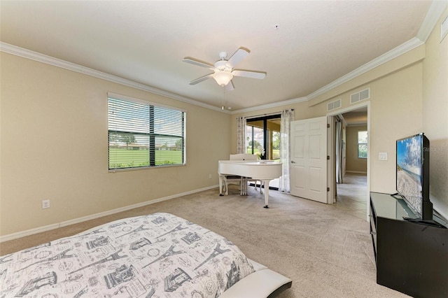 carpeted bedroom featuring ceiling fan and ornamental molding