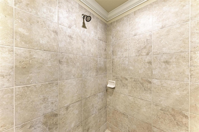 interior details with a tile shower