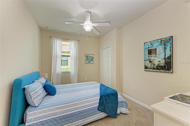 bedroom with ceiling fan and light colored carpet