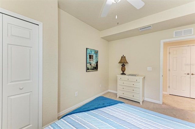 carpeted bedroom with a closet and ceiling fan