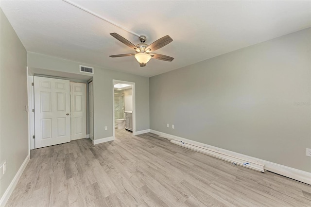 unfurnished bedroom with a closet, ceiling fan, connected bathroom, and light hardwood / wood-style flooring