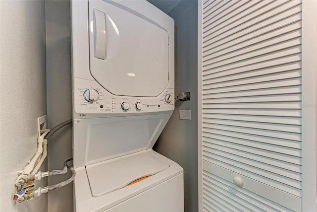 washroom with stacked washer / dryer