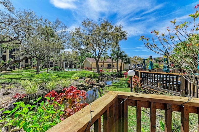 view of yard featuring a playground and a water view