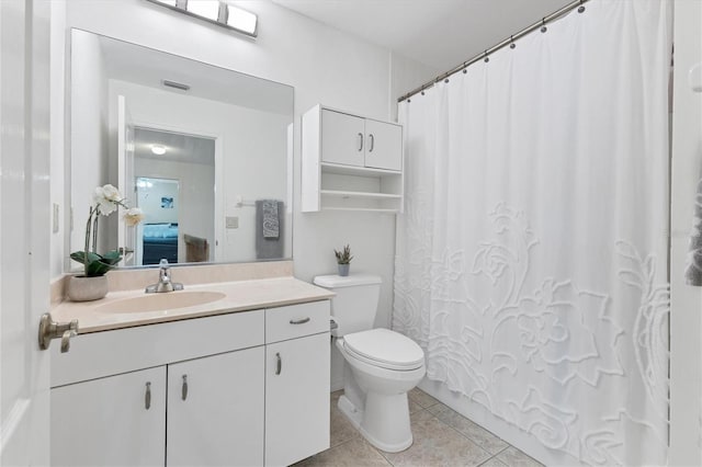 bathroom featuring curtained shower, visible vents, toilet, vanity, and tile patterned floors