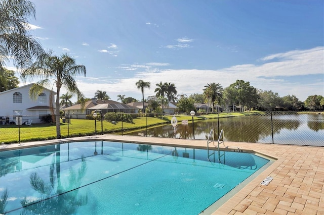 pool featuring a water view and fence