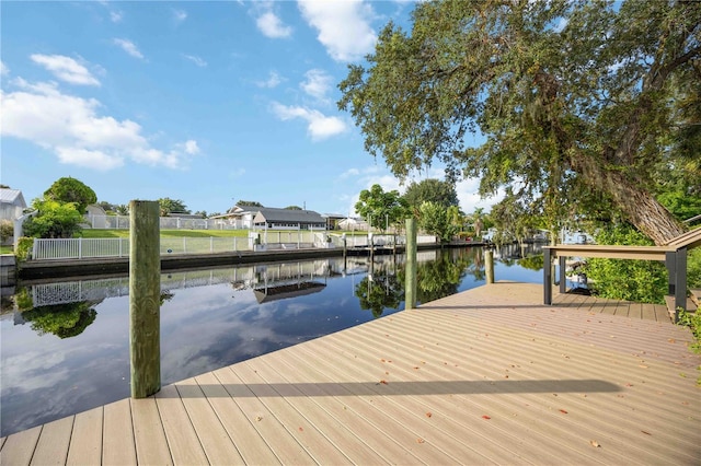 dock area featuring a water view and a residential view