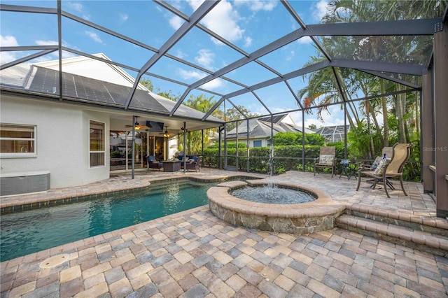 pool with ceiling fan, a lanai, central AC unit, an in ground hot tub, and a patio