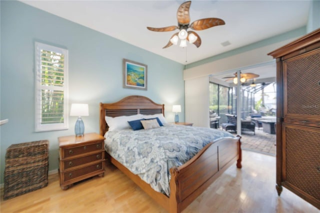 bedroom with access to exterior, wood finished floors, visible vents, and ceiling fan