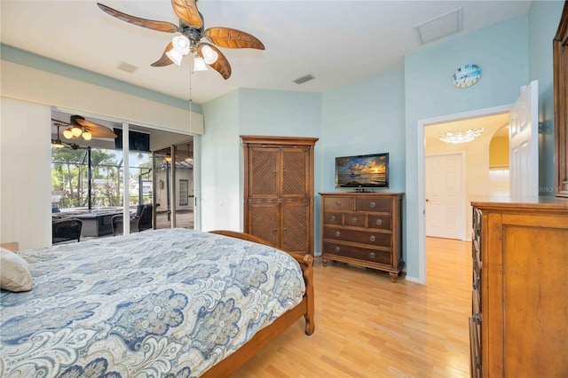 bedroom with visible vents, access to exterior, and light wood-style flooring