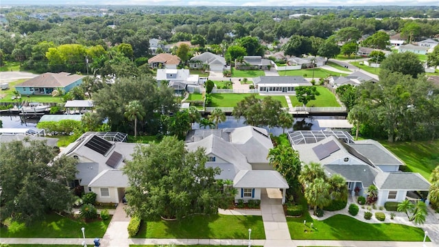 birds eye view of property with a residential view