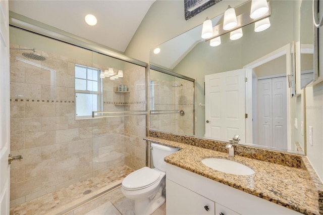 full bathroom with toilet, vaulted ceiling, a stall shower, tile patterned floors, and vanity