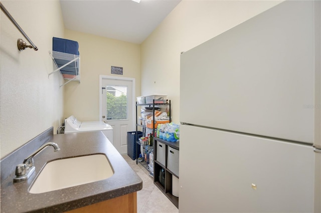 4532 Shark Dr, Bradenton, FL 34208 - washroom with a sink, light tile patterned floors, and laundry area