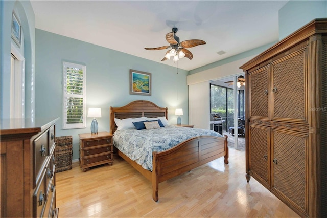 4532 Shark Dr, Bradenton, FL 34208 - bedroom featuring baseboards, access to outside, light wood finished floors, and ceiling fan