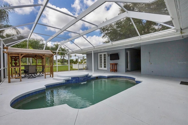 view of pool featuring a gazebo, glass enclosure, a patio, and french doors