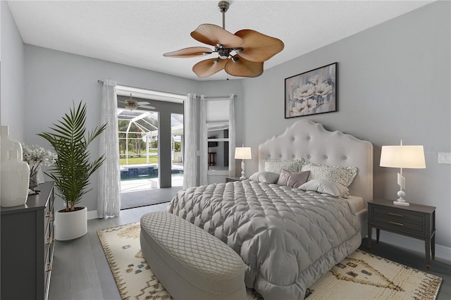 bedroom with access to outside, ceiling fan, wood-type flooring, and a textured ceiling