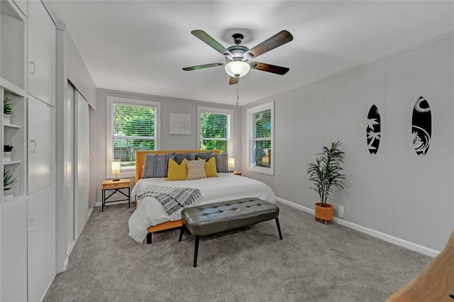 bedroom featuring ceiling fan and light colored carpet