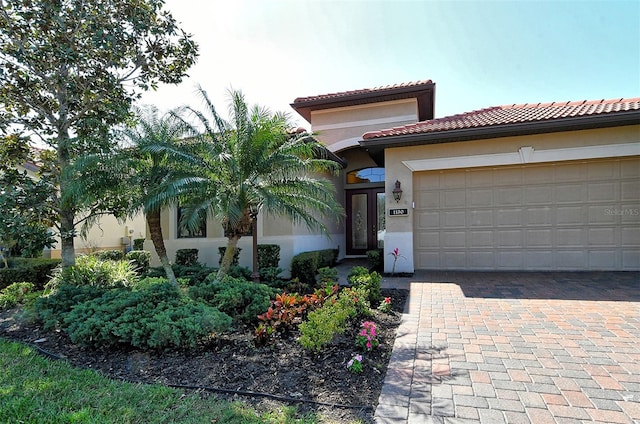 mediterranean / spanish-style home featuring a garage